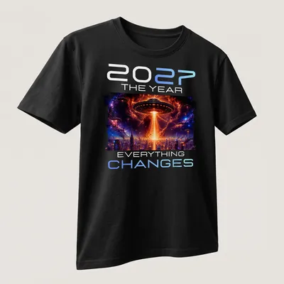 Sci-fi design featuring an alien UFO with bold text: '2027 THE YEAR EVERYTHING CHANGES' — printed on a unisex t-shirt (angled view)