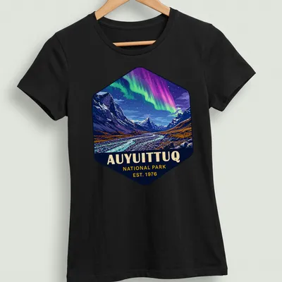 Auyuittuq National Park T-shirt with vibrant landscape illustration and established date — printed on a women's shirt