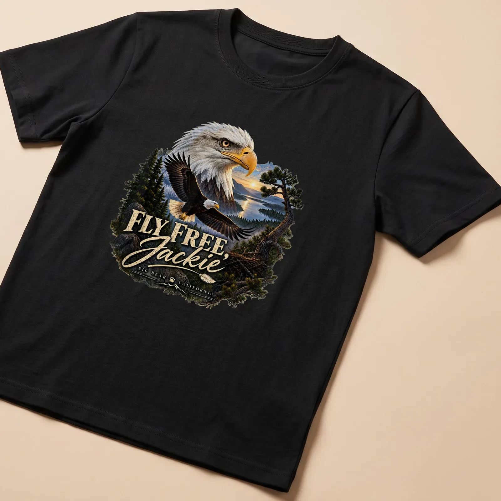 Realistic print of a Bald Eagle flying with text FLY FREE, Jackie BIG BEAR CALIFORNIA — printed on a unisex t-shirt