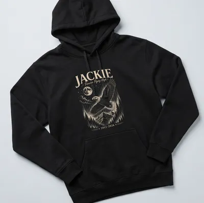 Detailed illustration of a Bald Eagle soaring with text about Jackie. — printed on a unisex hoodie