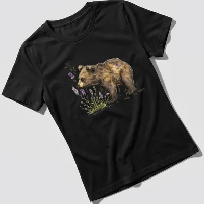 Watercolor illustration of a bear cub sniffing lavender flowers in soft colors — printed on a women's shirt