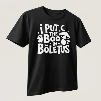 Whimsical typography with Boletus mushroom graphic and punny text — printed on a unisex t-shirt (angled view)