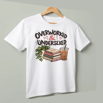 Illustrative design featuring books and coffee with the phrase 'Overworked & Undersexed' in fun typography — printed on a unisex t-shirt (angled view)