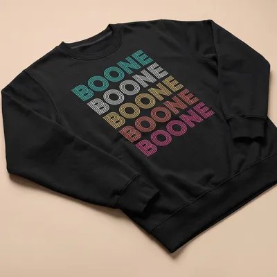 Brightly colored Boone t-shirt with playful striped text design. — printed on a unisex sweatshirt