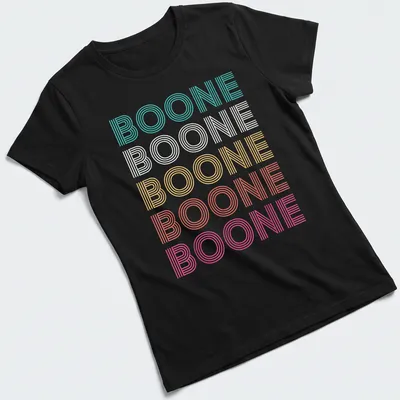 Brightly colored Boone t-shirt with playful striped text design. — printed on a women's shirt