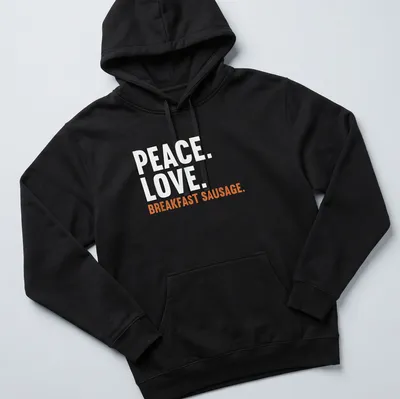 Bold text design featuring 'Peace. Love. Breakfast Sausage.' on a white tee. — printed on a unisex hoodie