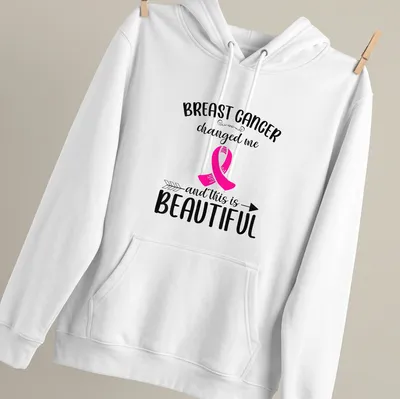 T-shirt featuring a bold message about breast cancer awareness with a pink ribbon — printed on a unisex hoodie