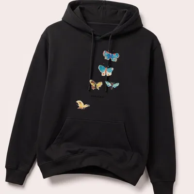 Watercolor print of colorful butterflies surrounding the word 'origins' in elegant script — printed on a unisex hoodie