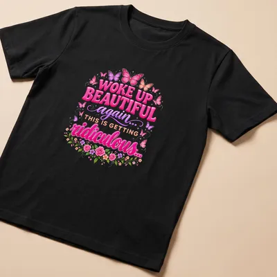 Colorful butterflies and whimsical text on a nature-inspired t-shirt.