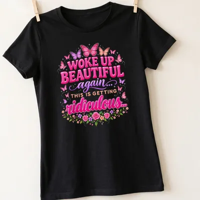 Colorful butterflies and whimsical text on a nature-inspired t-shirt. — printed on a women's shirt