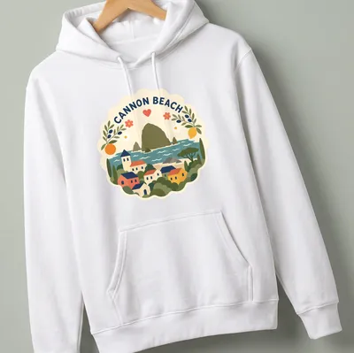 Illustration of Cannon Beach landscape in modern folk art style with vibrant colors — printed on a unisex hoodie