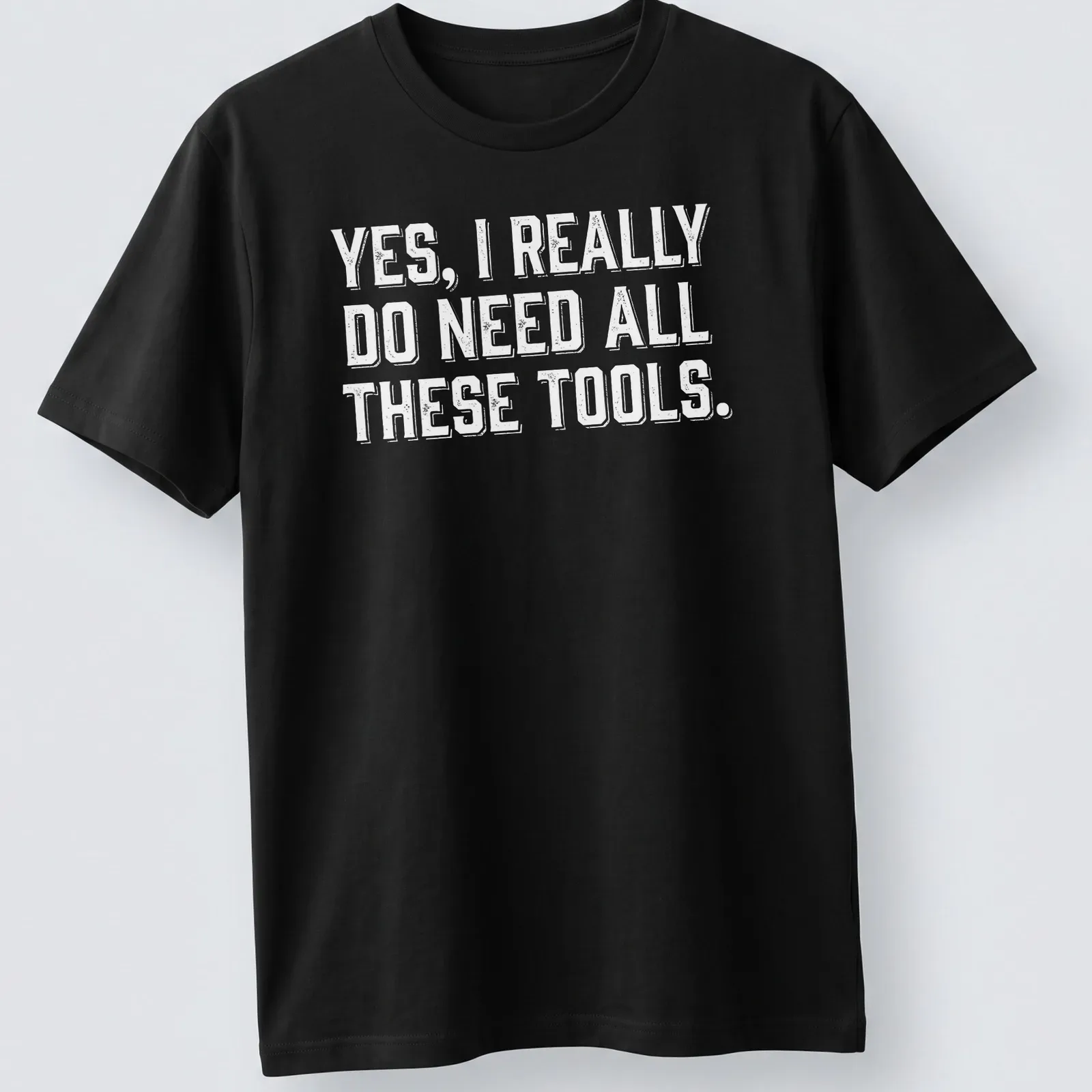 Bold typography Carpenter T-shirt with a humorous message about tools — printed on a unisex t-shirt