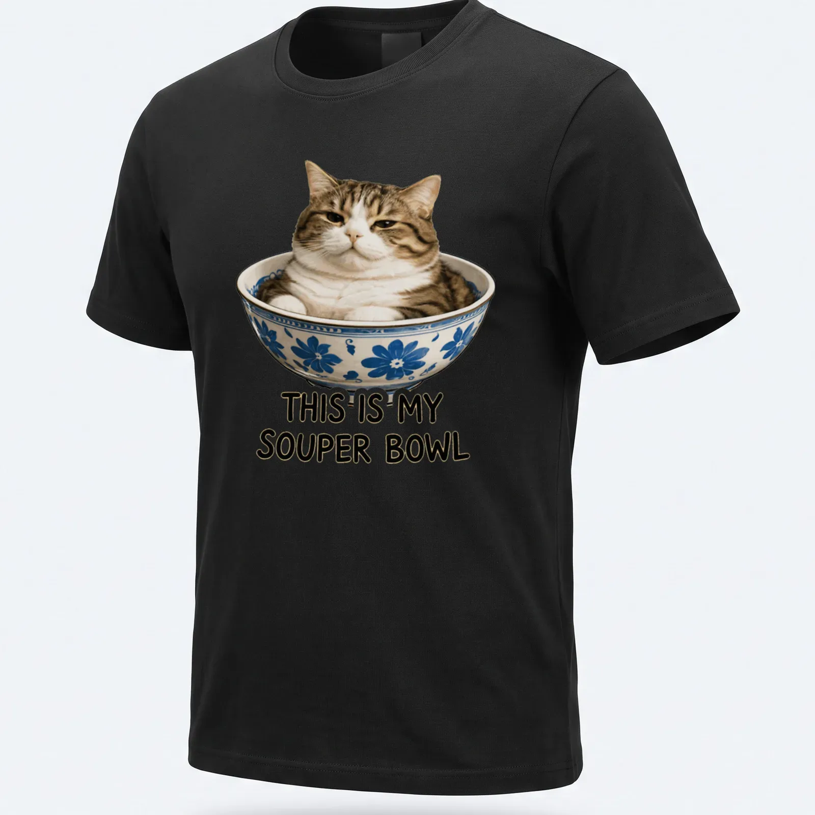 Realistic print of a cat comfortably sitting in a bowl with humorous text — printed on a unisex t-shirt