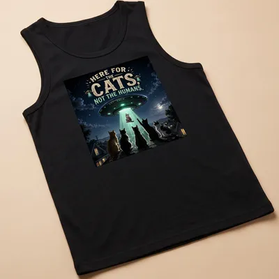 Detailed sci-fi print of cats being abducted by a UFO, with playful text. — printed on a tank top
