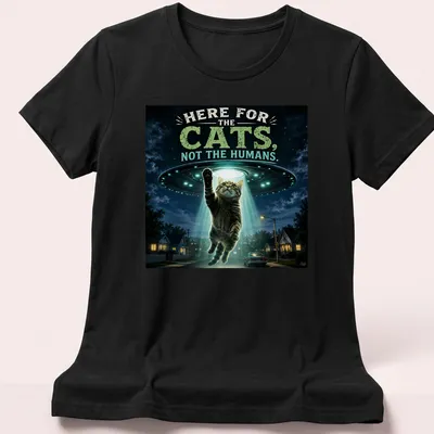 Playful design of cats being abducted by a UFO with whimsical colors — printed on a women's shirt