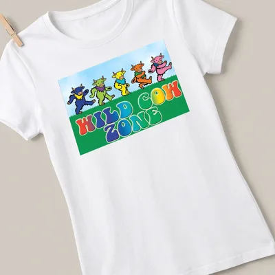 Cartoonish colorful cows dancing with text 'WILD COW ZONE' — printed on a women's shirt