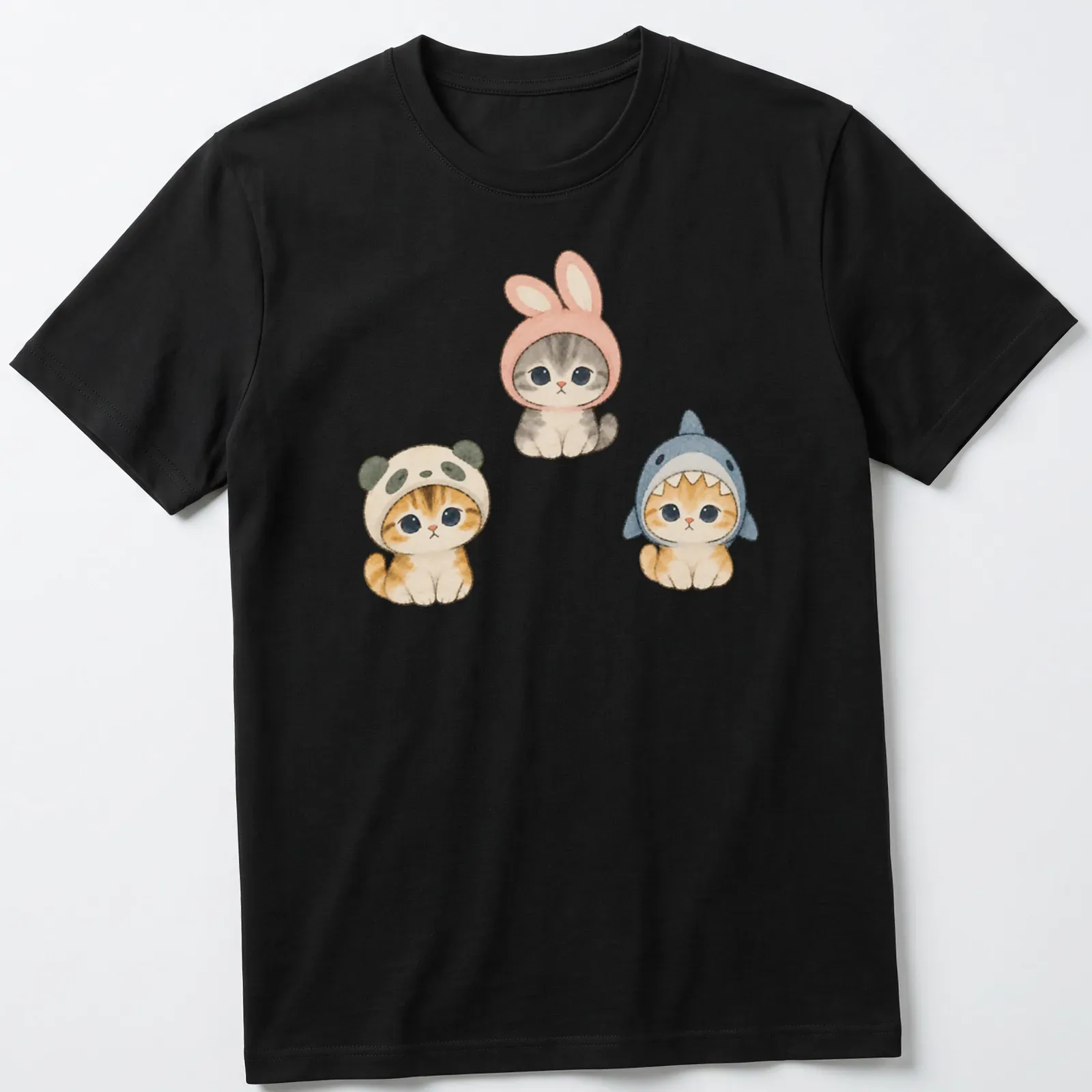 Watercolor print of cute kittens dressed as a panda, bunny, and shark — printed on a unisex t-shirt