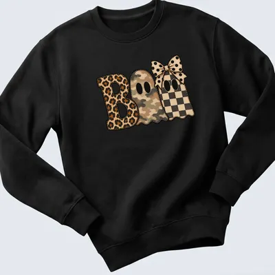 Whimsical patchwork shirt featuring cute ghosts and 'Boo' text in various patterns — printed on a unisex sweatshirt