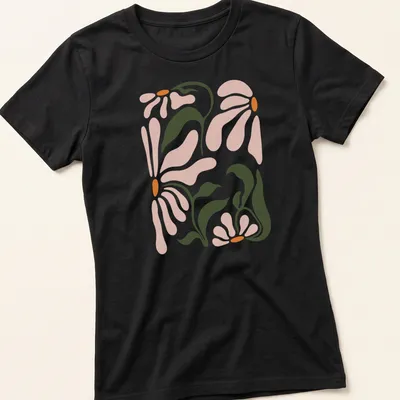 Abstract floral design featuring daisy flowers in pink, green, and orange — printed on a women's shirt