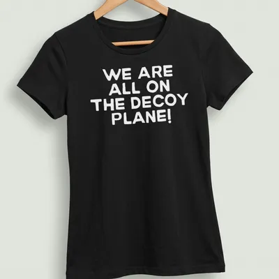 Minimalist design featuring a decoy plane with text about shared experiences — printed on a women's shirt