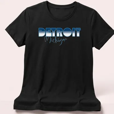 Modern bold print of Detroit Michigan USA in blue and white. — printed on a women's shirt