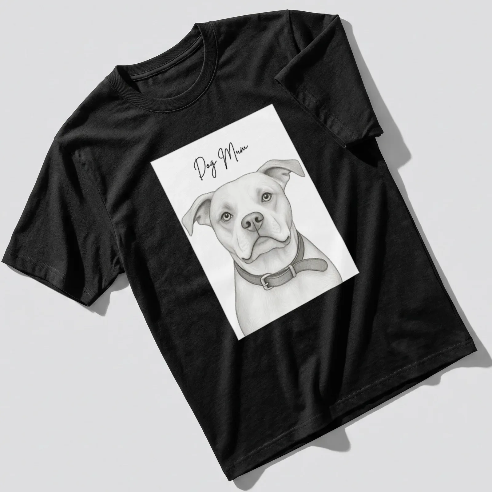 Sketch-style t-shirt displaying a 'Dog Mum' text with a dog illustration — printed on a unisex t-shirt