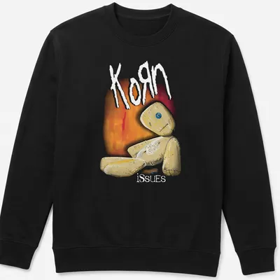 Illustrative print featuring a quirky doll and the text Korn issues in playful colors. — printed on a unisex sweatshirt