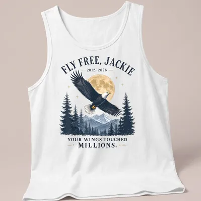 Vintage style t-shirt featuring an eagle with the text FLY FREE, JACKIE 2012-2026 YOUR WINGS TOUCHED MILLIONS. — printed on a tank top