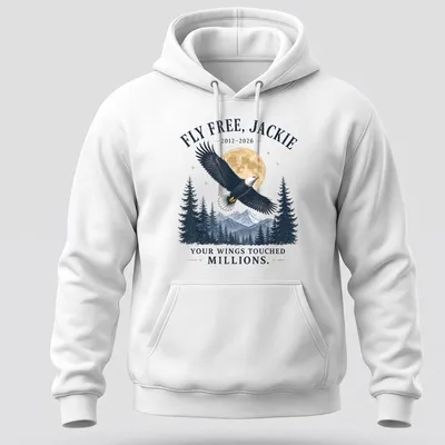 Vintage style t-shirt featuring an eagle with the text FLY FREE, JACKIE 2012-2026 YOUR WINGS TOUCHED MILLIONS. — printed on a unisex hoodie