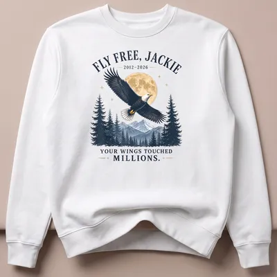 Vintage style t-shirt featuring an eagle with the text FLY FREE, JACKIE 2012-2026 YOUR WINGS TOUCHED MILLIONS. — printed on a unisex sweatshirt