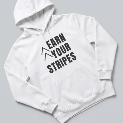 Bold typography t-shirt with the message 'Earn Your Stripes' in black and white. — printed on a unisex hoodie