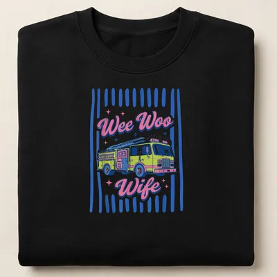 Colorful fire truck shirt with 'Wee Woo Wife' text in playful font — printed on a unisex sweatshirt