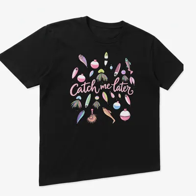 Pastel illustrated fishing lures with playful text 'Catch me later' on a — printed on a unisex t-shirt (angled view)