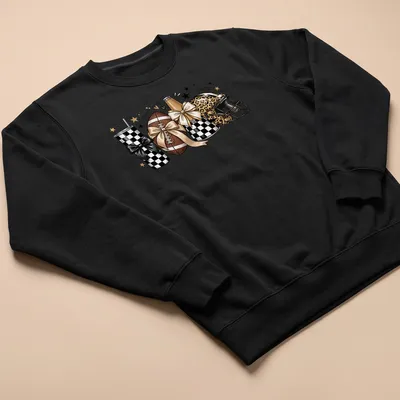 Cute football-themed t-shirt with leopard print helmet, tumbler, and bows — printed on a unisex sweatshirt