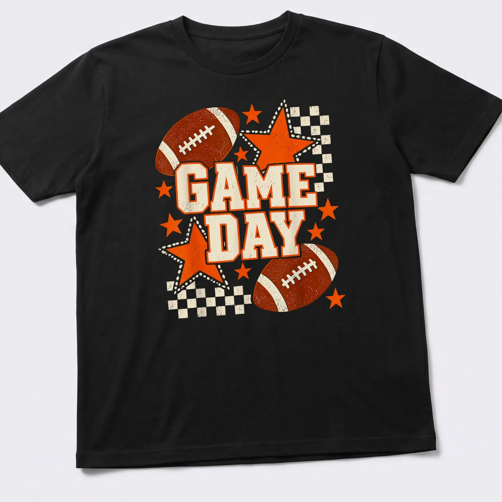 Retro distressed Game Day t-shirt featuring a football and stars in black and orange — printed on a unisex t-shirt