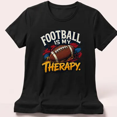 Vintage distressed t-shirt proclaiming football as therapy with colorful graphics — printed on a women's shirt
