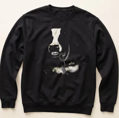 Realistic cow wearing a grillz chain in hip hop style with gold and black accents — printed on a unisex sweatshirt