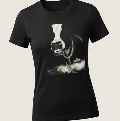 Realistic cow wearing a grillz chain in hip hop style with gold and black accents — printed on a women's shirt