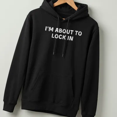 Bold white text on a humorous design stating I'm About To Lock In — printed on a unisex hoodie