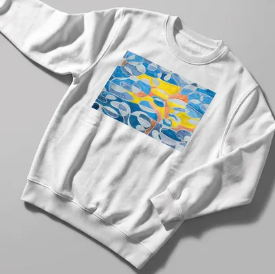 Geometric abstract design in blue, grey, mustard, orange, and white — printed on a unisex sweatshirt