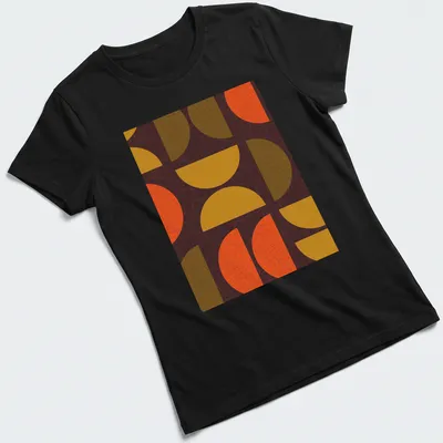Textured geometric shapes t-shirt in warm colors of orange, yellow, brown, and green — printed on a women's shirt
