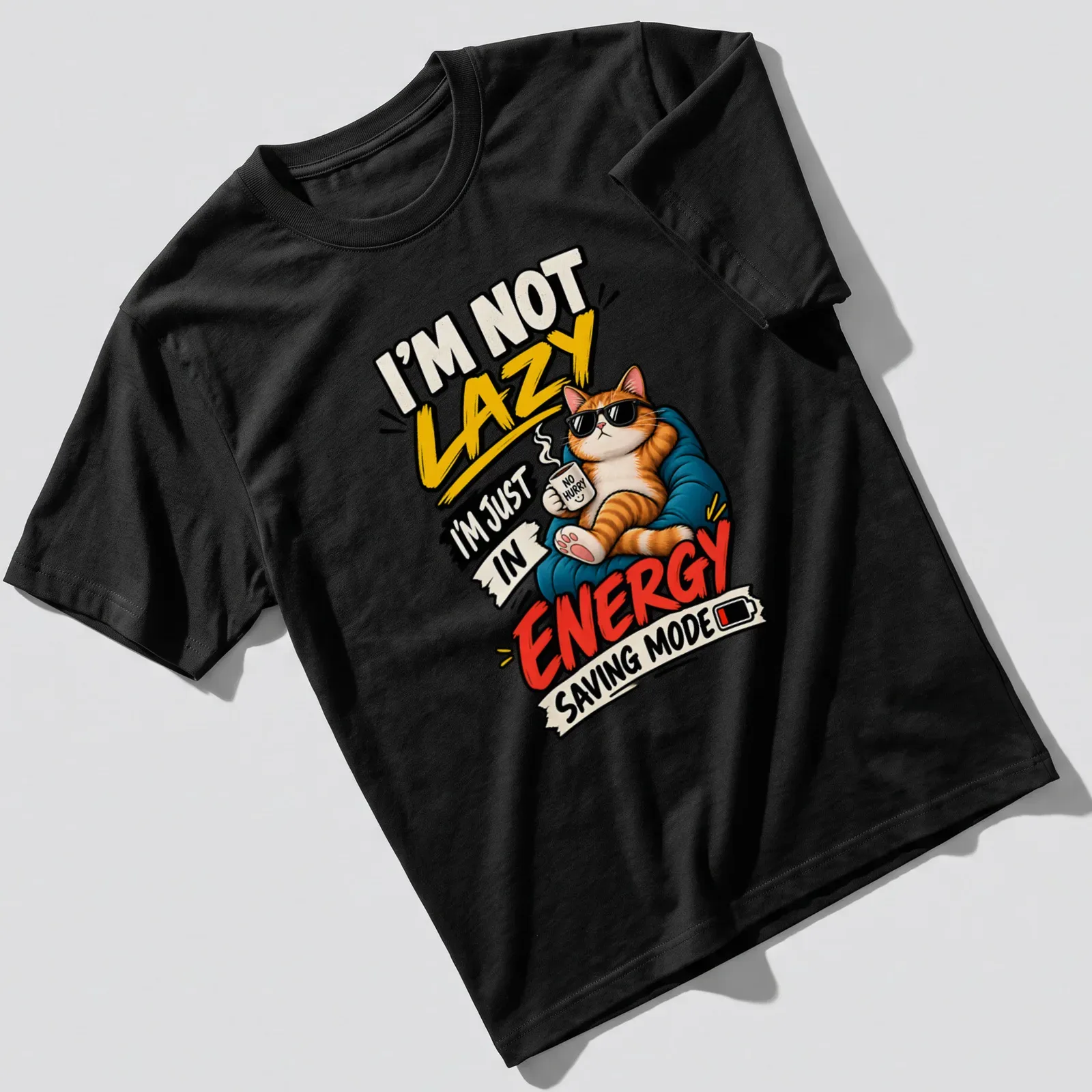 Bold cartoon ginger cat in sunglasses with humorous text about energy saving mode — printed on a unisex t-shirt