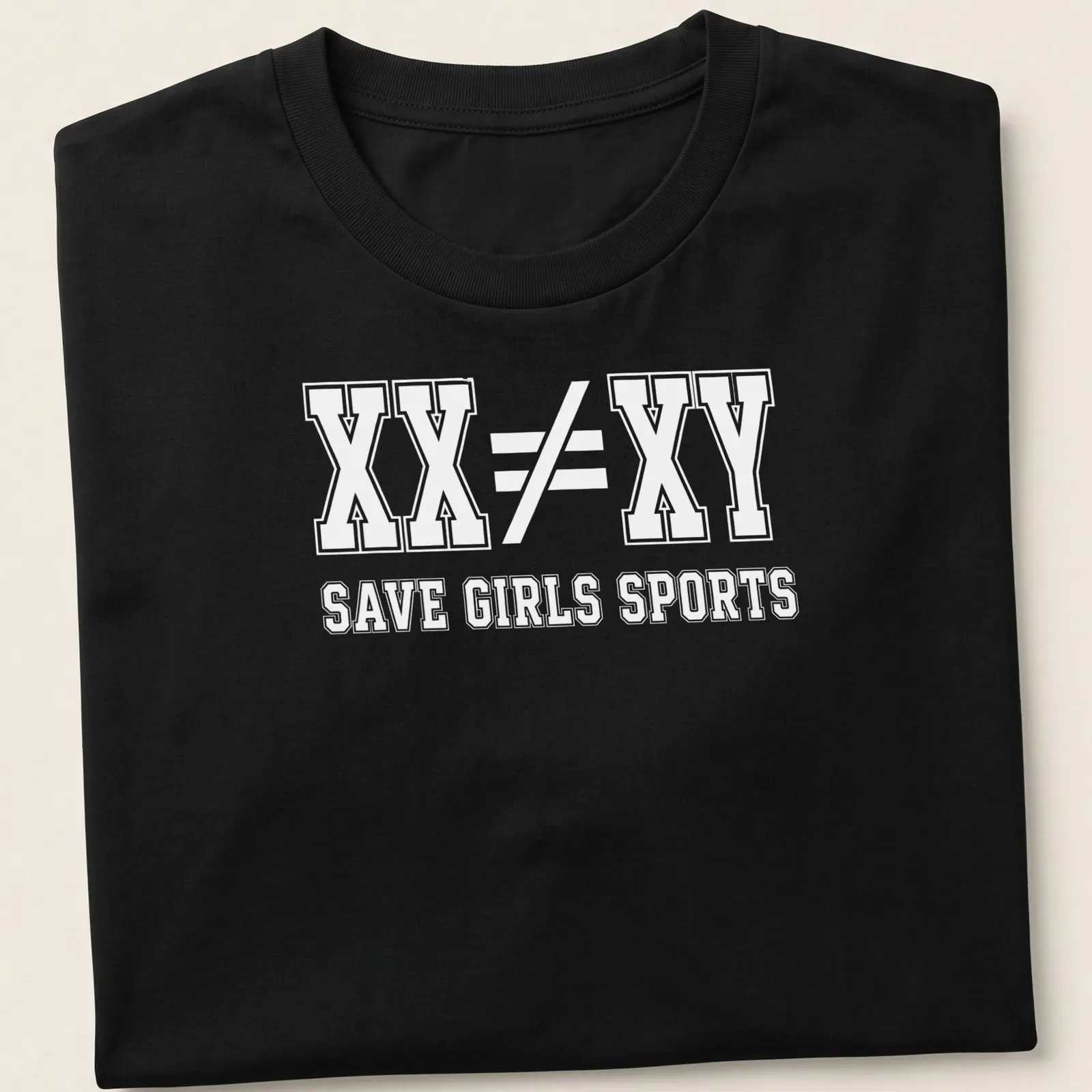 Bold typography t-shirt with the message XX ≠ XY SAVE GIRLS SPORTS — printed on a unisex t-shirt