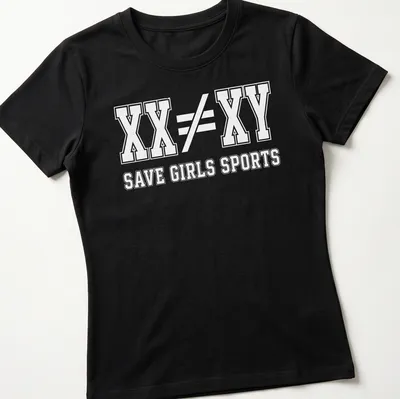 Bold typography t-shirt with the message XX ≠ XY SAVE GIRLS SPORTS — printed on a women's shirt