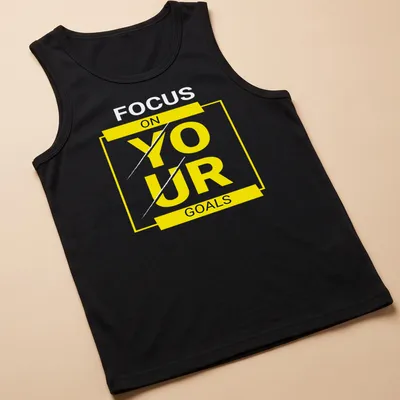 Bold typography shirt with motivational text 'FOCUS ON YOUR GOALS' in yellow, black, and white. — printed on a tank top