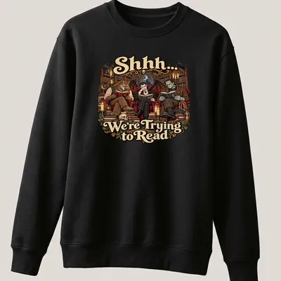 Gothic monsters reading with whimsical text on a dark-themed — printed on a unisex sweatshirt