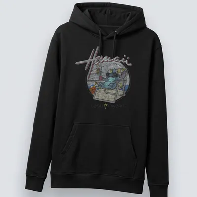 Cartoon alien character on a Hawaii Local Favorite t-shirt with colorful text — printed on a unisex hoodie