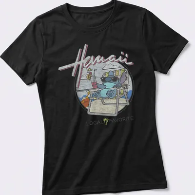 Cartoon alien character on a Hawaii Local Favorite t-shirt with colorful text — printed on a women's shirt