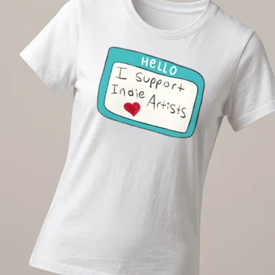Colorful name tag style t-shirt that says 'Hello I Support Indie Artists' — printed on a women's shirt
