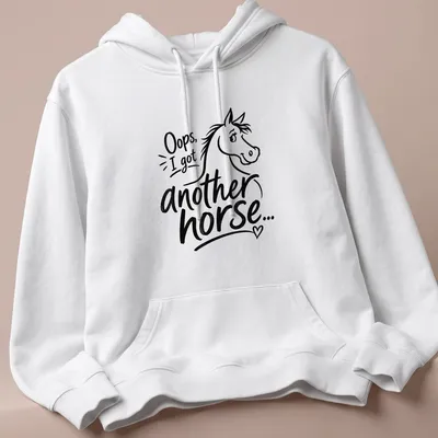 Playful line-art t-shirt with a horse and the text 'Oops, I got another horse...' — printed on a unisex hoodie